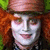 A pixelated image of a character with white face paint, orange hair, and a red hat on the left side, next to fragmented text reading 'I used to be much more MUCH-IER' in various fonts.
