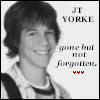 Black-and-white portrait of a person with shoulder-length hair wearing a striped shirt and suspenders, with text reading "JT YORKE" and "gone but not forgotten."