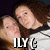 Two people with brown hair pose closely together in a pixelated image, one wearing a white shirt with dark trim.