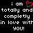 Black background with white pixelated text reading "i am totally and completely in love within you!" repeated twice, each preceded by a red heart symbol.