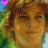 repeated pixelated faces with brown hair and green background, featuring animated text changes above each face