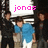 A pixelated image of a group of people with text overlays and a heart symbol, showing animation changes in text and background elements.