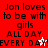 Red background with repeated black text 'Jon loves to be with girls ALL DAY EVERY DAY!' and two white star icons.