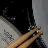 A 48x48 pixel animated contact sheet showing two frames of a drummer icon with visible motion blur and grayscale tones on the left, alongside text elements including "drummers" and musical symbols on the right.