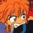 Pixelated anime-style character with spiky orange hair, wide eyes, and a broad grin, wearing a dark blue shirt against a blurred background.