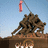 A pixelated image of the Iwo Jima Memorial with a red flag, overlaid on a solid red background containing white text phrases.