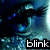A pixelated close-up of a blue-toned character's eyes with visible eyelashes and pupils, accompanied by the word 'blink' in white text on black background.