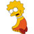 Pixelated character with yellow hair, white eyes, and a red mouth, wearing a yellow top and red skirt, facing left against a white background.