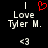 A black background displays white text 'Love Tyler M.' with a red heart symbol above the text and a pixelated '<3' symbol below it.