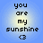 Four identical pixelated text on a blue gradient background, each displaying 'you are my sunshine <3' in black block letters