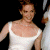 A pixelated image of a person in a white sleeveless dress against dark background, with green text reading "Original Icons .com" on the right.