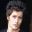 Four pixelated portrait views of a person with dark hair against varying backgrounds, including black and brown tones.