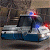 Animated pixel art of a character in dark clothing with blue and red lights, positioned on the left side of a split-screen layout.