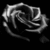 Pixelated grayscale icon of a stylized, abstracted figure with flowing lines and curved shapes against black background.