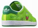 Green shoe with frog face, white sole, and green heel featuring a three-stripe logo.