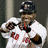 A pixelated image of a baseball player in a white uniform with red accents, holding a bat, next to blue background text celebrating the Red Sox winning the World Series.
