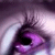 A four- of a close-up eye with purple irises and white sclera, showing text overlays and subtle animation changes