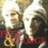 Two pixelated figures in white headwear and red clothing appear on a light green background with text overlays reading "You Know You Love" and "THE TWINZIES! Live on Forever".