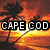 Pixelated beach sunset scene with palm trees and text overlays reading "Sun," "CAPE COD," "Sand," and "HOT GUYS."