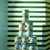 Pixelated static image shows a figure in blue and white attire holding an object against horizontal striped background.