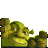 Pixelated green cartoon character with large eyes and a wide mouth, positioned on a white background with partial dark borders.