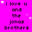 A bright pink background displays repeated text "i love u and the jonas brothers" with scattered white stars, some of which change position across frames.