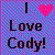 Two side-by-side pixelated images display "I Love Cody!" text with a pink heart symbol on the left and a blue heart symbol on the right against a checkered background.