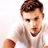 Static pixelated icon of a man with short brown hair wearing a white shirt, cropped to show upper body and arm against plain background.