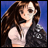 A pixelated 48x48 buddy icon featuring a character with long brown hair and a dark jacket over a white shirt on the left, paired with "Anime IM" text in silver stylized font on a black background to the right.