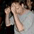 A person in a light gray shirt and shorts holds their hands near their face, with text reading "Mr. Caudle cutting a rug" on the right.