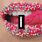 A static image of a mouth with pink lips covered in colorful sprinkles, overlaid with the text "I" on a black rectangle.