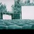 Pixelated static image showing two white rectangular shapes against a teal and gray background with a dark lower border.
