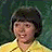 A 48x48 pixel buddy icon featuring a person in a yellow shirt with dark hair against a green background, paired with text elements on adjacent panels of a contact sheet layout.
