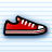 Pixelated red low-top sneaker with white laces, black trim, and a gray sole on light blue striped background.