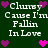 Dark green background with white pixelated text reading "Clunby Cause I'm Fallin In Love" repeated twice, surrounded by purple and pink heart icons.