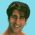 Pixelated static image of a person with dark hair against light blue background, showing partial upper body and face in low-resolution style.