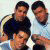 Pixelated static image of four male figures in a contact-sheet layout with overlapping poses and varying shirt colors against a light background.