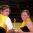 Two people in yellow shirts stand close together against a dark background with text reading "Best Friends Forever!!<8 lulas!!" on the right.