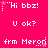Pixelated text and symbols on a bright pink background with white and light pink elements, showing repeated phrases and animated cursor-like changes.