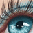 A close-up of a blue eye with visible eyelashes and skin tones, accompanied by cyan text elements on black background.