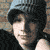 Animated contact sheet of Fall Out Boy member Patrick Stump in blue beanie with repeated text overlays on brick background