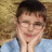 A person in a light blue shirt rests their chin on hands against a textured brown background with overlaid white text.