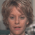 Static 50x50 pixel icon showing a close-up of a person's face with brown curly hair, visible facial features including eyes and mouth, and partial clothing in the background.