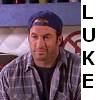 A static image shows a person wearing a blue cap and plaid shirt with vertical text reading LUCKE on the right side.