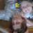 Two people lie on a bed with pillows, one person's head moves from left to right across frames while the other remains static.