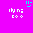 A static image with a bright pink background, white text reading 'flying solo' on both sides, and a cyan pixelated heart symbol above the text.
