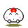 A 4-frame pixel art contact sheet showing a white round character with pink cheeks, red flower on head, and changing expressions while emitting colorful particles.