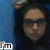 A person with dark hair and glasses appears in a of four , the top-right shows text reading 'damaged' while the bottom-left is blurred