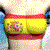 A pixelated figure in a red and yellow striped top with two circular patterns on the chest, blue hair, and a light blue tie, shown in two with slight movement