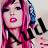 Pixelated image of a person with long pink hair, dark bangs, and red lips holding a black microphone against a light background.